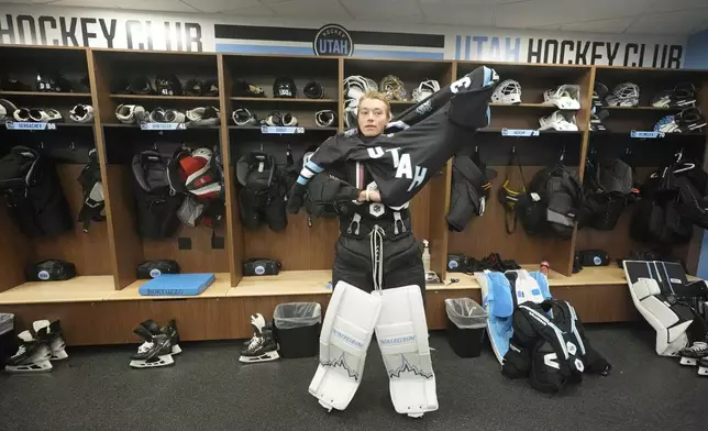 Utah Hockey Club goaltender Matt Villalta suits up in the new temporary practice facility locker room at the Olympic Oval Tuesday, Sept. 17, 2024, in Kearns, Utah. (AP Photo/Rick Bowmer)