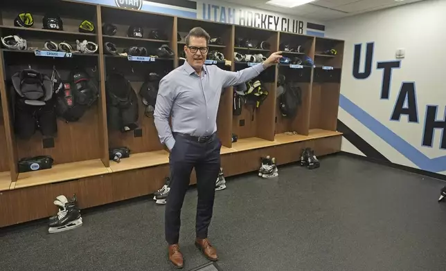 Utah Hockey Club general manager Bill Armstrong points during a tour of the new temporary practice facility locker room at the Olympic Oval Tuesday, Sept. 17, 2024, in Kearns, Utah. (AP Photo/Rick Bowmer)