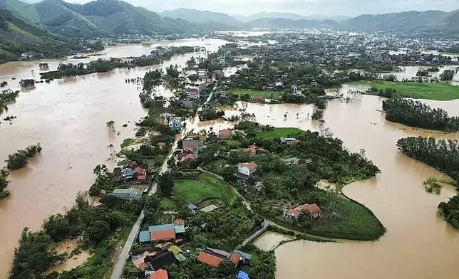 Flood triggered by Typhoon Yagi submerges houses in Bac Giang province, Vietnam Sunday, Sept. 8, 2024. (Le Danh Lam/VNA via AP)