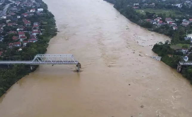 A bridge collapse due to floods triggered by typhoon Yagi in Phu Tho province, Vietnam on Monday, Sept. 9, 2024 (Bui Van Lanh/ VNA via AP)