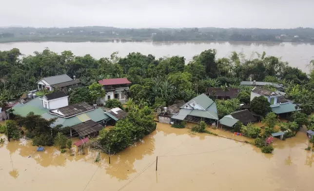 Flood triggered by Typhoon Yagi submerges houses in Phu Tho province, Vietnam Monday, Sept. 9, 2024. (Ta Van Toan/VNA via AP)