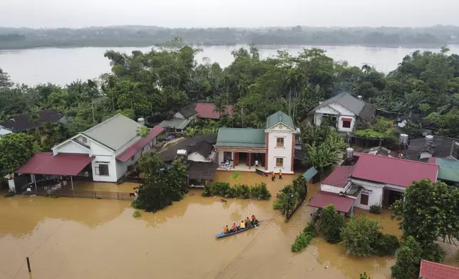 Flood triggered by Typhoon Yagi submerges houses in Phu Tho province, Vietnam Monday, Sept. 9, 2024. (Ta Van Toan/VNA via AP)