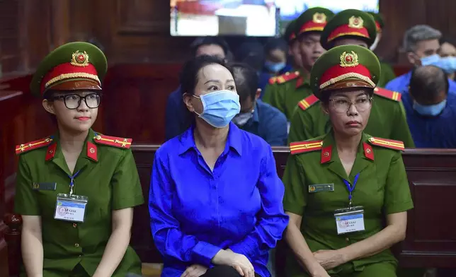 Business woman Truong My Lan, center, a real estate tycoon sentenced to death for financial fraud, attends her second trial in Vietnam's largest fraud case in Ho Chi Minh City, Vietnam Thursday, Sept. 19, 2024. (Thanh Tung/VNExpress via AP)