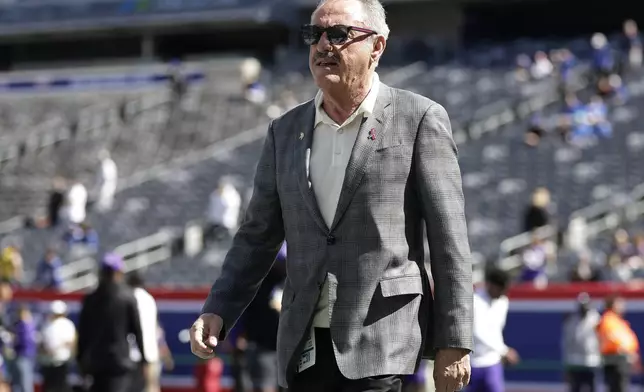 Minnesota Vikings owner Zygi Wilf walks across the field before an NFL football game against the New York Giants, Sunday, Sept. 8, 2024, in East Rutherford, N.J. (AP Photo/Adam Hunger)