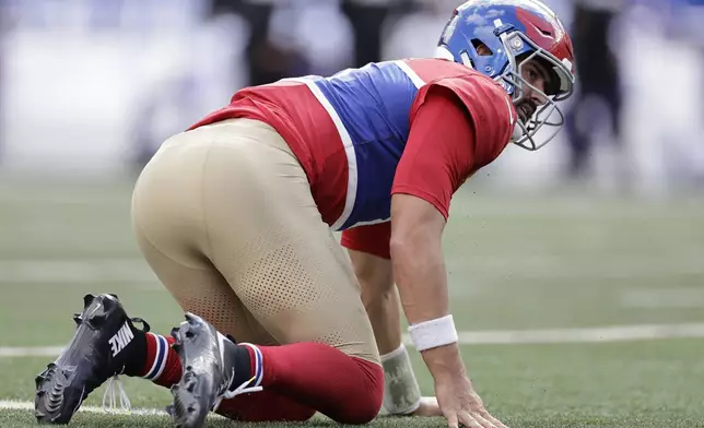 New York Giants quarterback Daniel Jones (8) looks on after being tackled during the second half of an NFL football game against the Minnesota Vikings, Sunday, Sept. 8, 2024, in East Rutherford, N.J. (AP Photo/Adam Hunger)