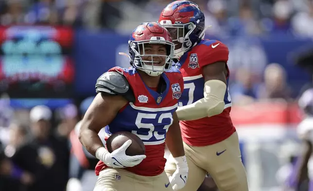 New York Giants linebacker Darius Muasau (53) celebrates after intercepting a pass during the second half of an NFL football game against the Minnesota Vikings, Sunday, Sept. 8, 2024, in East Rutherford, N.J. (AP Photo/Adam Hunger)