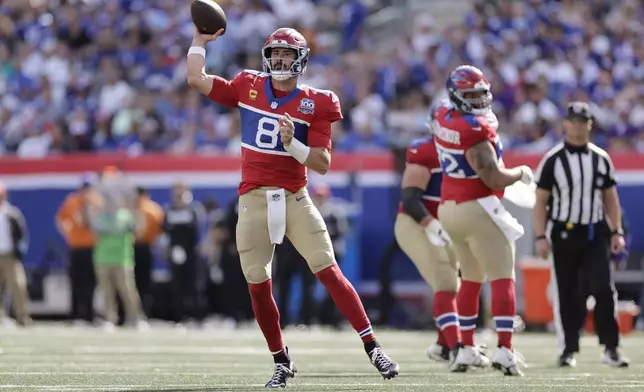 New York Giants quarterback Daniel Jones (8) passes during the second half of an NFL football game against the Minnesota Vikings, Sunday, Sept. 8, 2024, in East Rutherford, N.J. (AP Photo/Adam Hunger)