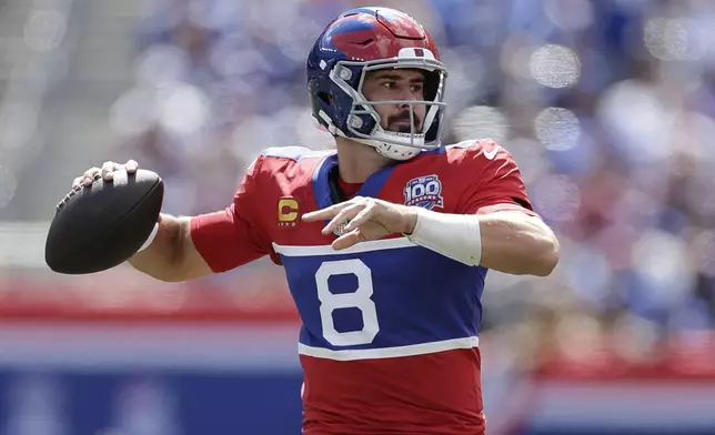 New York Giants quarterback Daniel Jones (8) looks to pass during the first half of an NFL football game against the Minnesota Vikings, Sunday, Sept. 8, 2024, in East Rutherford, N.J. (AP Photo/Adam Hunger)