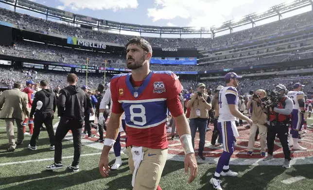 New York Giants quarterback Daniel Jones (8) walks off the field after the 28-6 loss to the Minnesota Vikings of an NFL football game, Sunday, Sept. 8, 2024, in East Rutherford, N.J. (AP Photo/Adam Hunger)