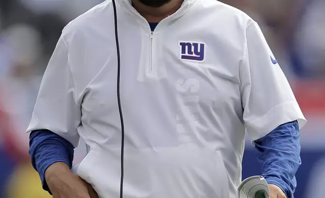 New York Giants head coach Brian Daboll walks down the sideline during the second half of an NFL football game against the Minnesota Vikings, Sunday, Sept. 8, 2024, in East Rutherford, N.J. (AP Photo/Adam Hunger)