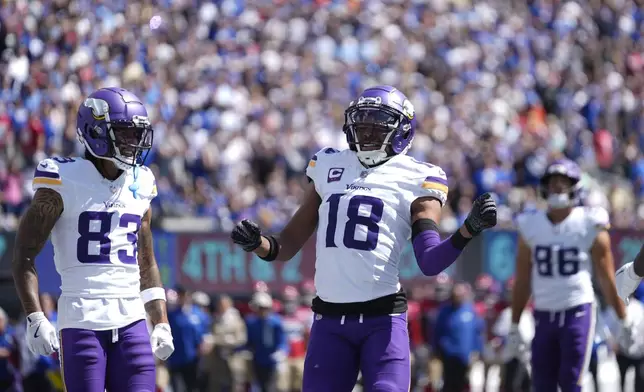 Minnesota Vikings wide receiver Justin Jefferson (18) celebrates after scoring a 3-yard touchdown during the first half of an NFL football game against the New York Giants, Sunday, Sept. 8, 2024, in East Rutherford, N.J. (AP Photo/Pamela Smith)