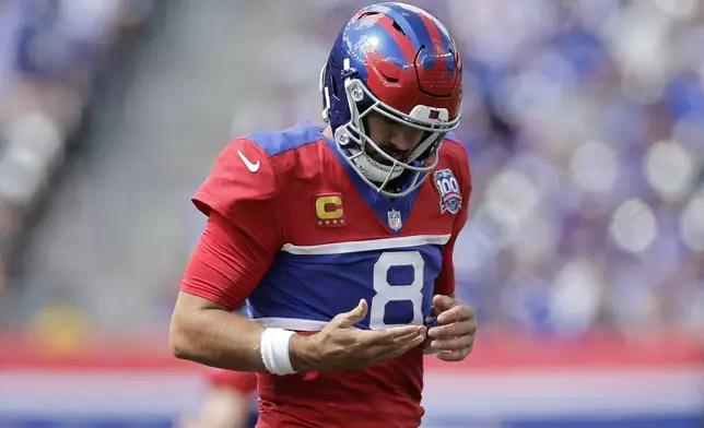 New York Giants quarterback Daniel Jones (8) jogs off the field during the first half of an NFL football game against the Minnesota Vikings, Sunday, Sept. 8, 2024, in East Rutherford, N.J. (AP Photo/Adam Hunger)