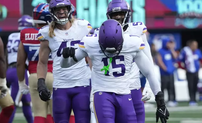 Minnesota Vikings linebacker Dallas Turner (15) celebrates after sacking New York Giants quarterback Daniel Jones (8) during the first half of an NFL football game, Sunday, Sept. 8, 2024, in East Rutherford, N.J. (AP Photo/Pamela Smith)