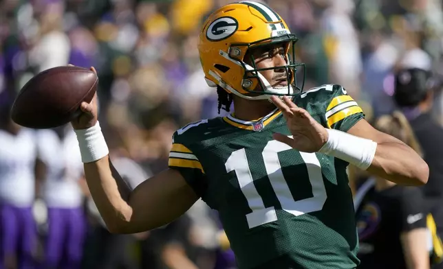 Green Bay Packers quarterback Jordan Love (10) warms before an NFL football game against the Minnesota Vikings, Sunday, Sept. 29, 2024, in Green Bay, Wis. (AP Photo/Morry Gash)