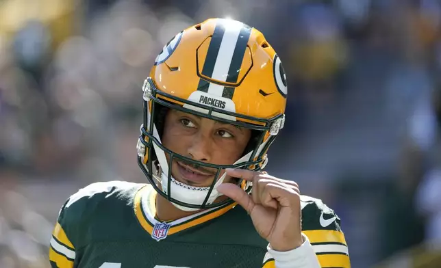 Green Bay Packers quarterback Jordan Love warms up before an NFL football game against the Minnesota Vikings, Sunday, Sept. 29, 2024, in Green Bay, Wis. (AP Photo/Morry Gash)