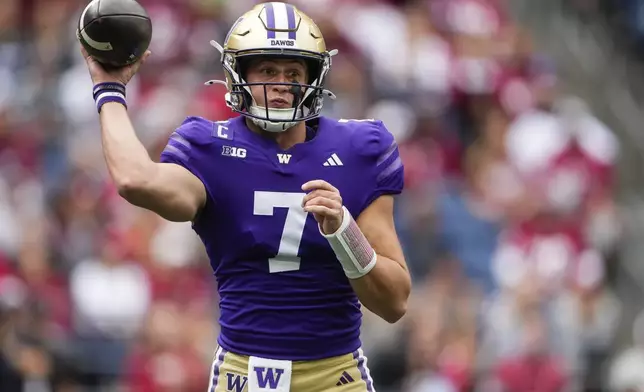 Washington quarterback Will Rogers (7) throws against Washington State during the first half of an NCAA college football game Saturday, Sept. 14, 2024, in Seattle. (AP Photo/Lindsey Wasson)