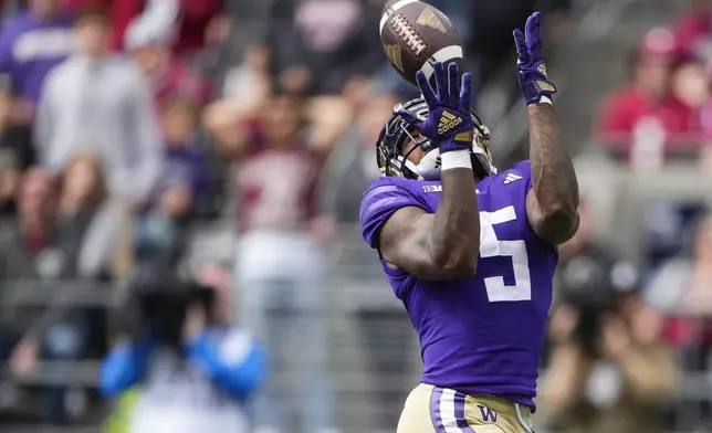 Washington wide receiver Giles Jackson (5) makes a touchdown catch against Washington State during the first half of an NCAA college football game Saturday, Sept. 14, 2024, in Seattle. (AP Photo/Lindsey Wasson)