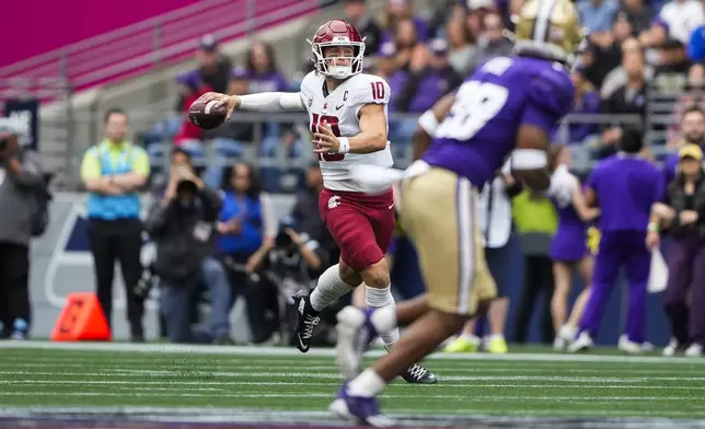 Washington State quarterback John Mateer (10) throws against Washington during the first half of an NCAA college football game Saturday, Sept. 14, 2024, in Seattle. (AP Photo/Lindsey Wasson)