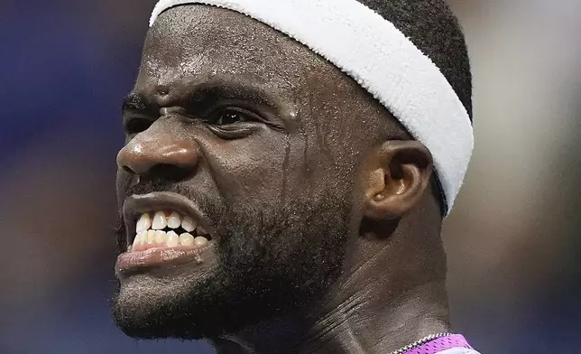 Frances Tiafoe, of the United States, reacts after scoring a point against Taylor Fritz, of the United States, during the men's singles semifinal of the U.S. Open tennis championships, Friday, Sept. 6, 2024, in New York. (AP Photo/Frank Franklin II)