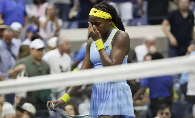 Coco Gauff, of the United States, reacts after losing to Emma Navarro, of the United States, during the fourth round of the U.S. Open tennis championships, Sunday, Sept. 1, in New York. 2024. (AP Photo/Pamela Smith)