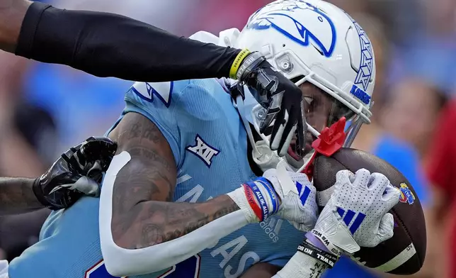 Lindenwood defensive back Tre Bell breaks up a pass intended for Kansas wide receiver Quentin Skinner during the first half of an NCAA college football game Thursday, Aug. 29, 2024, at Children's Mercy Park in Kansas City, Kan. (AP Photo/Charlie Riedel)