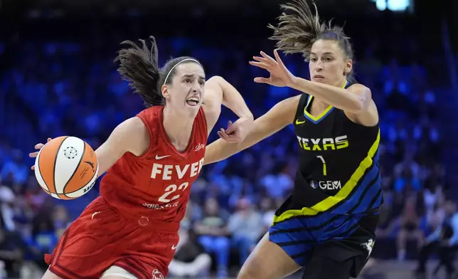 Indiana Fever guard Caitlin Clark (22) works to the basket against Dallas Wings guard Sevgi Uzun (1) in the first half of a WNBA basketball game Sunday, Sept. 1, 2024, in Arlington, Texas. (AP Photo/Tony Gutierrez)