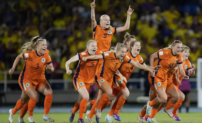 Dutch players celebrate defeating Colombia in a penalty shoot-out of a U-20 Women's World Cup quarterfinal soccer match at Pascual Guerrero Olympic stadium in Cali, Colombia, Sunday, Sept. 15, 2024. (AP Photo/Fernando Vergara)