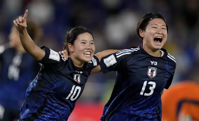 Japan's Tanaka Matsucubo, left, celebrates with teammate Maya Hijikata scoring her side's opening goal against Netherlands during a U-20 Women's World Cup semifinal soccer match in Cali, Colombia, Wednesday, Sept. 18, 2024. (AP Photo/Fernando Vergara)