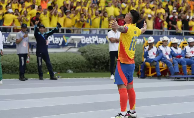 Colombia's James Rodriguez celebrates scoring a penalty, his side's second goal, against Argentina during a qualifying soccer match for the FIFA World Cup 2026 at the Metropolitano Roberto Melendez stadium in Barranquilla, Colombia, Tuesday, Sept. 10, 2024. (AP Photo/Ricardo Mazalan)