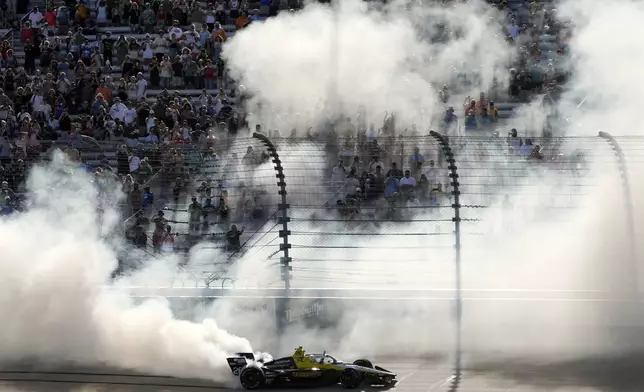 Colton Herta celebrates after winning an IndyCar auto race Sunday, Sept. 15, 2024, at Nashville Superspeedway in Lebanon, Tenn. (AP Photo/Mark Humphrey)