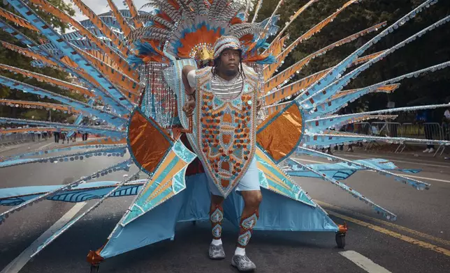 A reveler marches during the West Indian Day Parade on Monday, Sept. 2, 2024, in the Brooklyn borough of New York. (AP Photo/Andres Kudacki)