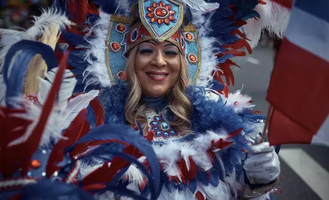 A reveler marches during the West Indian Day Parade on Monday, Sept. 2, 2024, in the Brooklyn borough of New York. (AP Photo/Andres Kudacki)