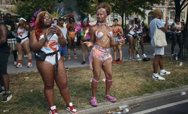 Revelers dance during the West Indian Day Parade on Monday, Sept. 2, 2024, in the Brooklyn borough of New York. (AP Photo/Andres Kudacki)