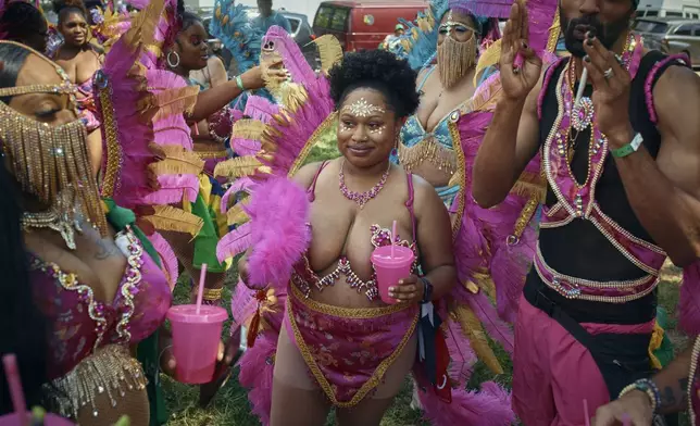 People march in the West Indian Day Parade on Monday, Sept. 2, 2024, in the Brooklyn borough of New York. (AP Photo/Andres Kudacki)