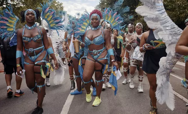 Revelers march during the West Indian Day Parade on Monday, Sept. 2, 2024, in the Brooklyn borough of New York. (AP Photo/Andres Kudacki)