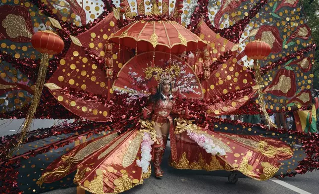 A reveler marches during the West Indian Day Parade on Monday, Sept. 2, 2024, in the Brooklyn borough of New York. (AP Photo/Andres Kudacki)