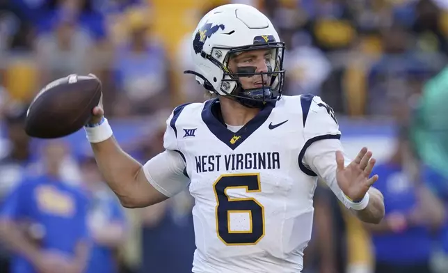 West Virginia quarterback Garrett Greene (6) looks to throw during the first half of an NCAA college football game against Pittsburgh Saturday, Sept. 14, 2024, in Pittsburgh. (AP Photo/Matt Freed)