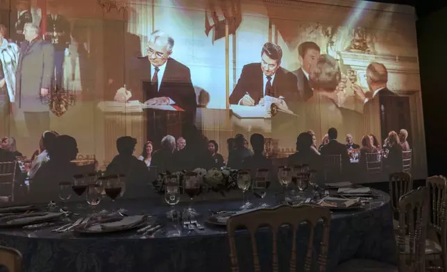 A 3D interactive room with dinner tables, music and videos of State Dinners at the White House shown at The People's House exhibit, Monday, Sept. 16, 2024 in Washington. (AP Photo/Jose Luis Magana)