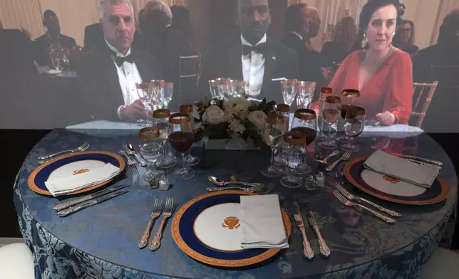 A 3D interactive room with dinner tables, music and videos of State Dinners at the White House, shown at The People's House exhibit, Monday, Sept. 16, 2024 in Washington. (AP Photo/Jose Luis Magana)