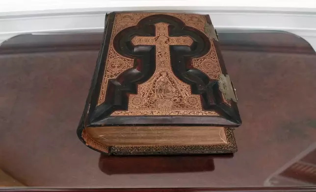 The replica of President Joe Biden family bible is seen in a replica of the Oval Office as is today, shown at The People's House exhibit, Monday, Sept. 16, 2024 in Washington. (AP Photo/Jose Luis Magana)