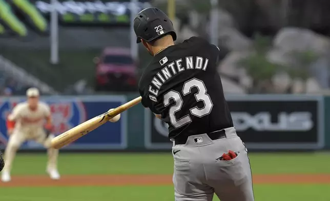 Chicago White Sox's Andrew Benintendi hits a two-run home run during the first inning of a baseball game against the Los Angeles Angels, Monday, Sept. 16, 2024, in Anaheim, Calif. (AP Photo/Mark J. Terrill)