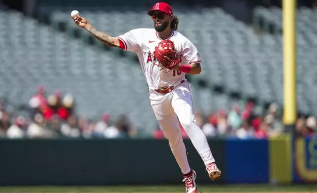 Los Angeles Angels shortstop Jack López throws to first to out Chicago White Sox's Lenyn Sosa during the fourth inning of a baseball game in Anaheim, Calif., Wednesday, Sept. 18, 2024. (AP Photo/Ashley Landis)