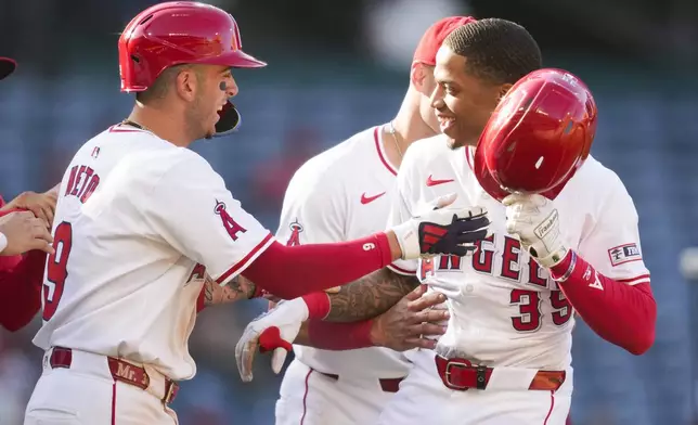 Los Angeles Angels' Jordyn Adams (39) celebrates after a walk-off single during the thirteenth inning to win 4-3 over the Chicago White Sox in a baseball game in Anaheim, Calif., Wednesday, Sept. 18, 2024. (AP Photo/Ashley Landis)