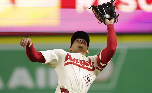 Los Angeles Angels right fielder Gustavo Campero makes a catch on a ball hit by Chicago White Sox's Andrew Vaughn during the seventh inning of a baseball game, Monday, Sept. 16, 2024, in Anaheim, Calif. (AP Photo/Mark J. Terrill)