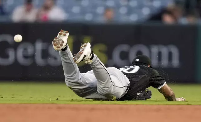 Chicago White Sox second baseman Lenyn Sosa can't get to a ball hit for a single by Los Angeles Angels' Taylor Ward during the first inning of a baseball game, Tuesday, Sept. 17, 2024, in Anaheim, Calif. (AP Photo/Mark J. Terrill)