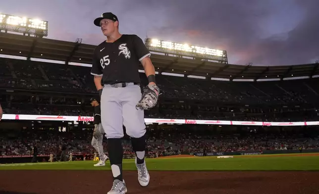 Chicago White Sox's Andrew Vaughn walks into the dugout after the second inning of a baseball game against the Los Angeles Angels, Monday, Sept. 16, 2024, in Anaheim, Calif. (AP Photo/Mark J. Terrill)