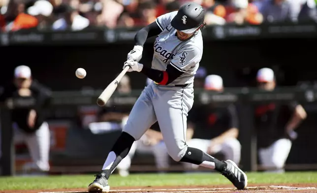 Chicago White Sox's Jacob Amaya hits a single during the first inning of a baseball game against the Baltimore Orioles, Monday, Sept. 2, 2024, in Baltimore. (AP Photo/Daniel Kucin Jr.)