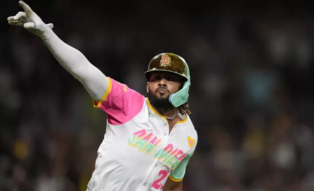 San Diego Padres' Fernando Tatis Jr. celebrates his walk off double during the tenth inning of a baseball game against the Chicago White Sox Friday, Sept. 20, 2024, in San Diego. The Padres won, 3-2. (AP Photo/Gregory Bull)