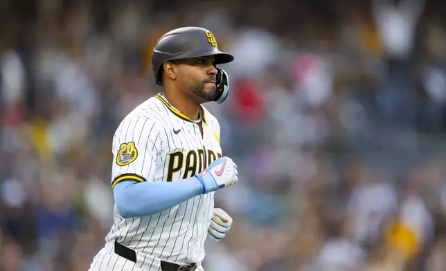 San Diego Padres' Xander Bogaerts runs after hitting a two-run home run during the second inning of a baseball game against the Chicago White Sox, Saturday, Sept. 21, 2024, in San Diego. (AP Photo/Ryan Sun)