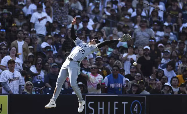 Chicago White Sox third baseman Miguel Vargas cannot catch a pop fly hit by San Diego Padres' Jackson Merrill in the seventh inning of a baseball game Sunday, Sept. 22, 2024, in San Diego. (AP Photo/Derrick Tuskan)